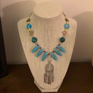 A beaded, tribal inspired, handmade necklace.